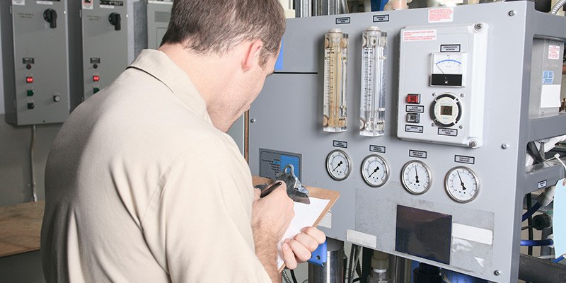 electrician with clipboard in action