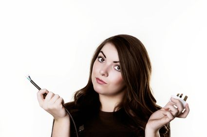 woman holding electric wire